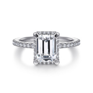 Gabriel & Co. ER14719E6W44JJ 14 karat white gold Classic engagement ring, front view of an emerald cut center with corner prongs and halo stones at its edge