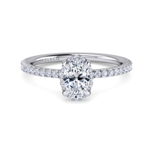 Gabriel & Co. ER14719O3W44JJ 14 karat white gold Classic engagement ring, front view of an oval center with small diamonds peeking out around its outline