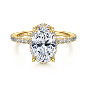 Gabriel & Co. ER14719O8Y44JJ 14 karat yellow gold Classic engagement ring, front view of an oval center with small diamonds peeking out around its outline