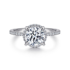 Gabriel & Co. ER14719R8W44JJ 14 karat white gold Classic engagement ring, front view of a round center with claw prongs and halo diamonds peeking out around its edge