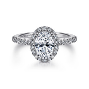 Gabriel & Co. ER14725O4W44JJ 14 karat white gold Classic engagement ring, front view of an oval center inside a halo of small round diamonds with claw tips showing