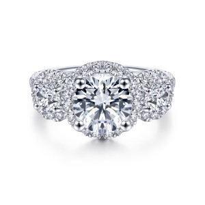 Gabriel & Co. ER14744R8W44JJ 14 karat white gold Contemporary engagement ring, front view of a round center and two side stones, each ringed by small diamonds