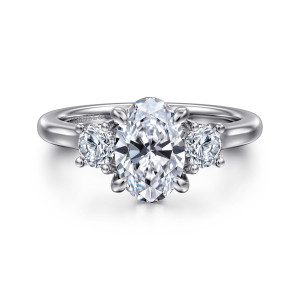 Gabriel & Co. ER14745O6W44JJ 14 karat white gold Classic engagement ring, front view of an oval center between two round side diamonds, each in small prongs