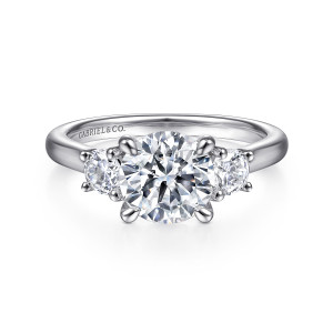 Gabriel & Co. ER14745R6PT4JJ platinum Classic engagement ring, front view of a round center between two prong set side stones on a smooth band