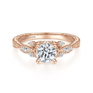 Gabriel & Co. ER14768R3K44JJ 14 karat rose gold Floral Nouveau engagement ring, front view of a round center flanked by leaf shaped shoulders holding small diamonds