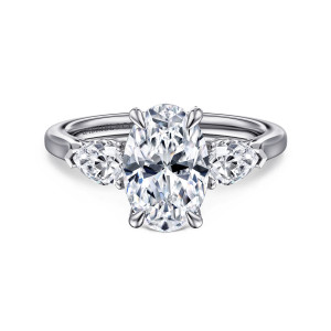 Gabriel & Co. ER14794O8W44JJ 14 karat white gold Classic engagement ring, front view of an oval center with claw prongs between two pear shaped side stones pointing outward