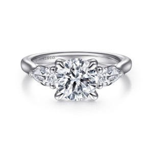 Gabriel & Co. ER14794R6PT4JJ platinum Classic engagement ring, front view of a round center with pear shaped side stones pointing outward on a smooth band