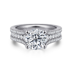 Gabriel & Co. ER14890R8W44JJ 14 karat white gold Contemporary engagement ring, front view of a round center above a wide band with larger stones between two fine pave rows