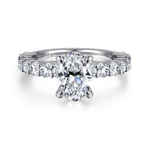 Gabriel & Co. ER14893O6W44JJ 14 karat white gold Classic engagement ring, front view of an oval center in four prongs with round diamonds beside it on the band