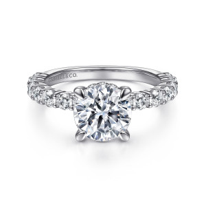 Gabriel & Co. ER14893R8PT4JJ platinum Classic engagement ring, front view of a round center in claw prongs above stones running along both shoulders