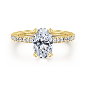 Gabriel & Co. ER14914O6Y44JJ 14 karat yellow gold Classic engagement ring, front view of an oval center with small diamonds along the shoulders of a thin band