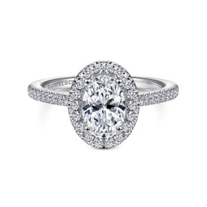 Gabriel & Co. ER14916O4W44JJ 14 karat white gold Classic engagement ring, front view of an oval center inside a halo with a scalloped edge and stones along the band