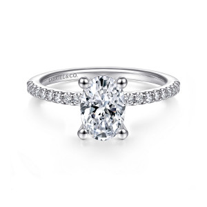 Gabriel & Co. ER14918O4W44JJ 14 karat white gold Classic engagement ring, front view of an oval center with four ball tipped prongs and diamonds beside the head
