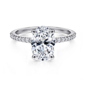 Gabriel & Co. ER14918O8W44JJ 14 karat white gold Classic engagement ring, front view of an oval center standing tall between two diamond lined shoulders