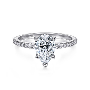 Gabriel & Co. ER14918P4W44JJ 14 karat white gold Classic engagement ring, front view of a pear shaped center with a V shaped prong at the point