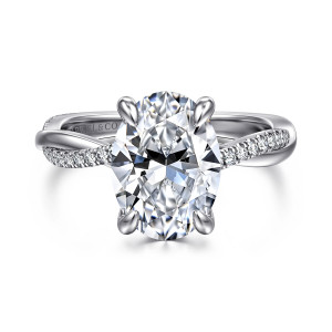 Gabriel & Co. ER14922O12W44JJ 14 karat white gold Contemporary engagement ring, front view of an oval center in rounded prongs above the crossing band