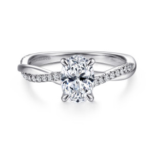 Gabriel & Co. ER14922O4W44JJ 14 karat white gold Contemporary engagement ring, front view of the twisting band with small diamonds rising to an oval center
