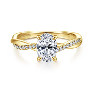 Gabriel & Co. ER14922O4Y44JJ 14 karat yellow gold Contemporary engagement ring, front view of an oval center held by slim prongs above a twisting, stone edged band