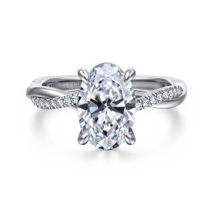 Gabriel & Co. ER14922O8W44JJ 14 karat white gold Contemporary engagement ring, front view of an oval center in claw prongs with diamonds on the twisting band