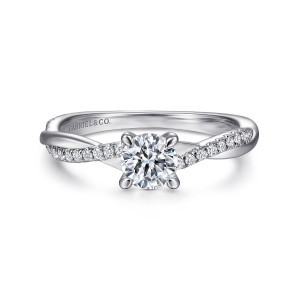 Gabriel & Co. ER14922R2W44JJ 14 karat white gold Contemporary engagement ring, front view of a round center with the two ribbons crossing at either side of its prongs