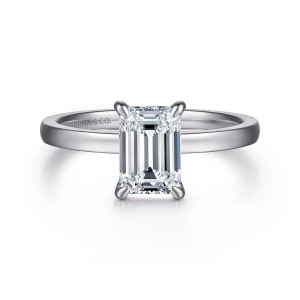 Gabriel & Co. ER14982E6W4JJJ 14 karat white gold Classic engagement ring, front view of an emerald cut center gripped at the corners by slim claws on a plain hoop