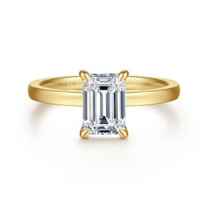 Gabriel & Co. ER14982E6Y4JJJ 14 karat yellow gold Classic engagement ring, front view of an emerald cut center standing lengthwise in slim claws above a flat topped band