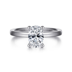 Gabriel & Co. ER14982O4W4JJJ 14 karat white gold Classic engagement ring, front view of an oval center on ball tipped prongs above a polished flat sided band
