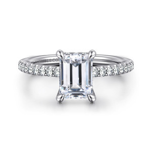 Gabriel & Co. ER14987E6W44JJ 14 karat white gold Classic engagement ring, front view of an emerald cut seat with corner claws and round diamonds along the shoulders