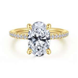 Gabriel & Co. ER14987O12Y44JJ 14 karat yellow gold Classic engagement ring, front view of an oval center on four teardrop tipped claws with diamonds along the band