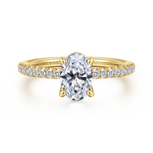 Gabriel & Co. ER14987O4Y44JJ 14 karat yellow gold Classic engagement ring, front view of an oval center with rounded prongs and diamonds along both shoulders