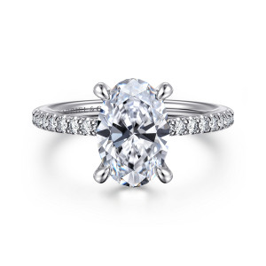 Gabriel & Co. ER14987O8W44JJ 14 karat white gold Classic engagement ring, front view of an oval center held by rounded prongs, with fine diamonds along the band