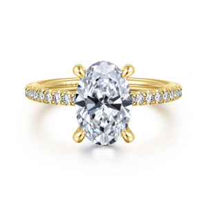 Gabriel & Co. ER14987O8Y44JJ 14 karat yellow gold Classic engagement ring, front view of an oval center with rounded prong tips and diamonds along both shoulders