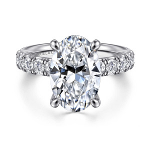 Gabriel & Co. ER14989O16W44JJ 14 karat white gold Classic engagement ring, front view of an oval center on four claw prongs, a row of round diamonds along each shoulder