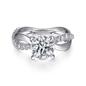 Gabriel & Co. ER14991R6W44JJ 14 karat white gold Contemporary engagement ring, front view of the round center on four claw prongs above a twisting shank of crossing strands