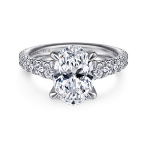 Gabriel & Co. ER14998O8W44JJ 14 karat white gold Contemporary engagement ring, front view of an oval center with round diamonds set along both shoulders of the band
