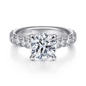 Gabriel & Co. ER15000R8W44JJ 14 karat white gold Contemporary engagement ring, front view of a round center in four rounded prongs above shoulders lined with round diamonds
