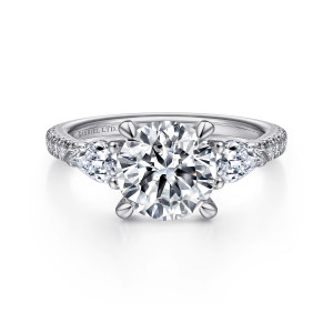 Gabriel & Co. ER15005R8W84JJ 18 karat white gold Contemporary engagement ring, front view of a round center between pear shaped side stones, with diamonds along the band