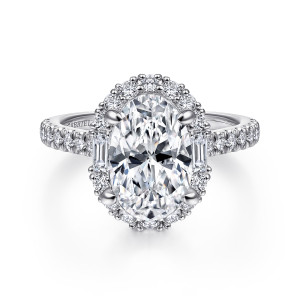 Gabriel & Co. ER15015O8PT4JJ platinum Contemporary engagement ring, front view of an oval center inside a halo of round diamonds with a baguette at each side