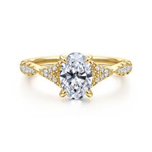 Gabriel & Co. ER15183O4Y44JJ 14 karat yellow gold Contemporary engagement ring, front view of an oval center with diamond triangle clusters and leaf shaped links at the shoulders