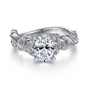 Gabriel & Co. ER15207O4W44JJ 14 karat white gold Floral Nouveau engagement ring, front view of the oval center framed by diamond set leaves and beaded curling scrolls