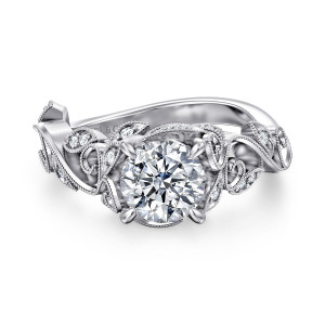 Gabriel & Co. ER15207R4PT4JJ platinum Floral Nouveau engagement ring, top view of a round center among leaf shaped diamond frames and beaded curling tendrils