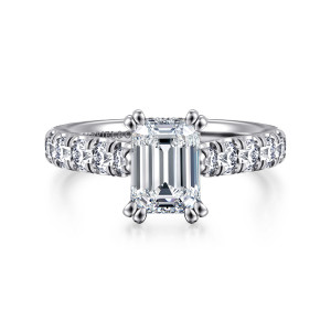 Gabriel & Co. ER15247E6W44JJ 14 karat white gold Classic engagement ring, front view of an emerald cut center in doubled ball tipped corner prongs between diamond shoulders