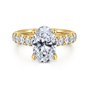 Gabriel & Co. ER15247O10Y44JJ 14 karat yellow gold Classic engagement ring, front view of the oval center on teardrop tipped claws with bold round diamonds along both shoulders