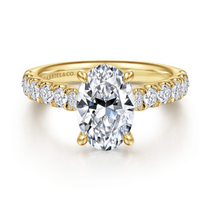 Gabriel & Co. ER15247O8Y44JJ 14 karat yellow gold Classic engagement ring, front view of an oval center on four rounded claws beside large round stones on the shoulders