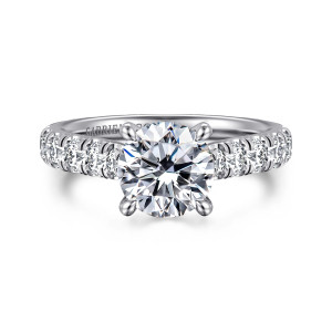Gabriel & Co. ER15247R6W44JJ 14 karat white gold Classic engagement ring, front view of a round center with four claw prongs above a band of round diamonds