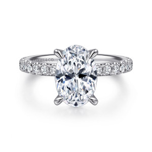 Gabriel & Co. ER15336O8W44JJ 14 karat white gold Classic engagement ring, front view of an oval center with teardrop tipped prongs above a slim band of round diamonds