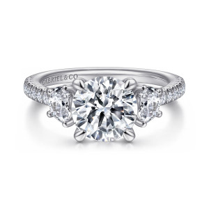 Gabriel & Co. ER15341R8W44JJ 14 karat white gold Contemporary engagement ring, front view of a round center held by four claw prongs between flat edged stones