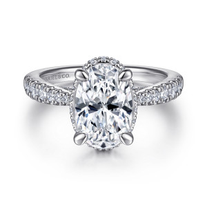 Gabriel & Co. ER15350O8W44JJ 14 karat white gold Victorian engagement ring, front view of an oval center in rounded claw prongs with tiny stones showing at its edge