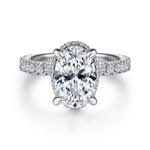 Gabriel & Co. ER15352O8W44JJ 14 karat white gold Classic engagement ring, front view of an oval center with four claw prongs and tiny stones showing at its rim