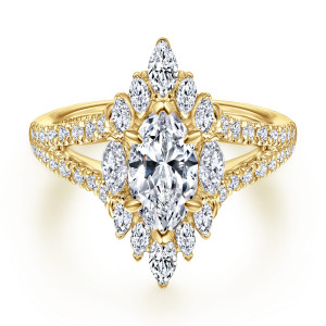 Gabriel & Co. ER15395M4Y44JJ 14 karat yellow gold Starlight engagement ring, front view of a tall burst of pointed stones around the marquise center with a divided shank